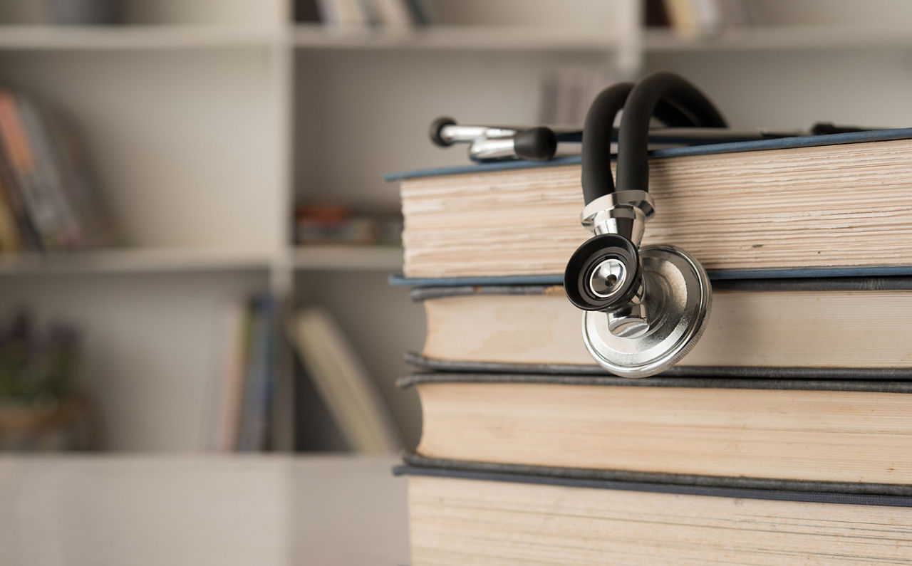 stethoscope on stack of medical guide book for doctor learning treatment at hospital.; Shutterstock ID 1114922669; purchase_order: PR2138319; job: OMG1131771 ; client: Healthcare NPS; other: 336