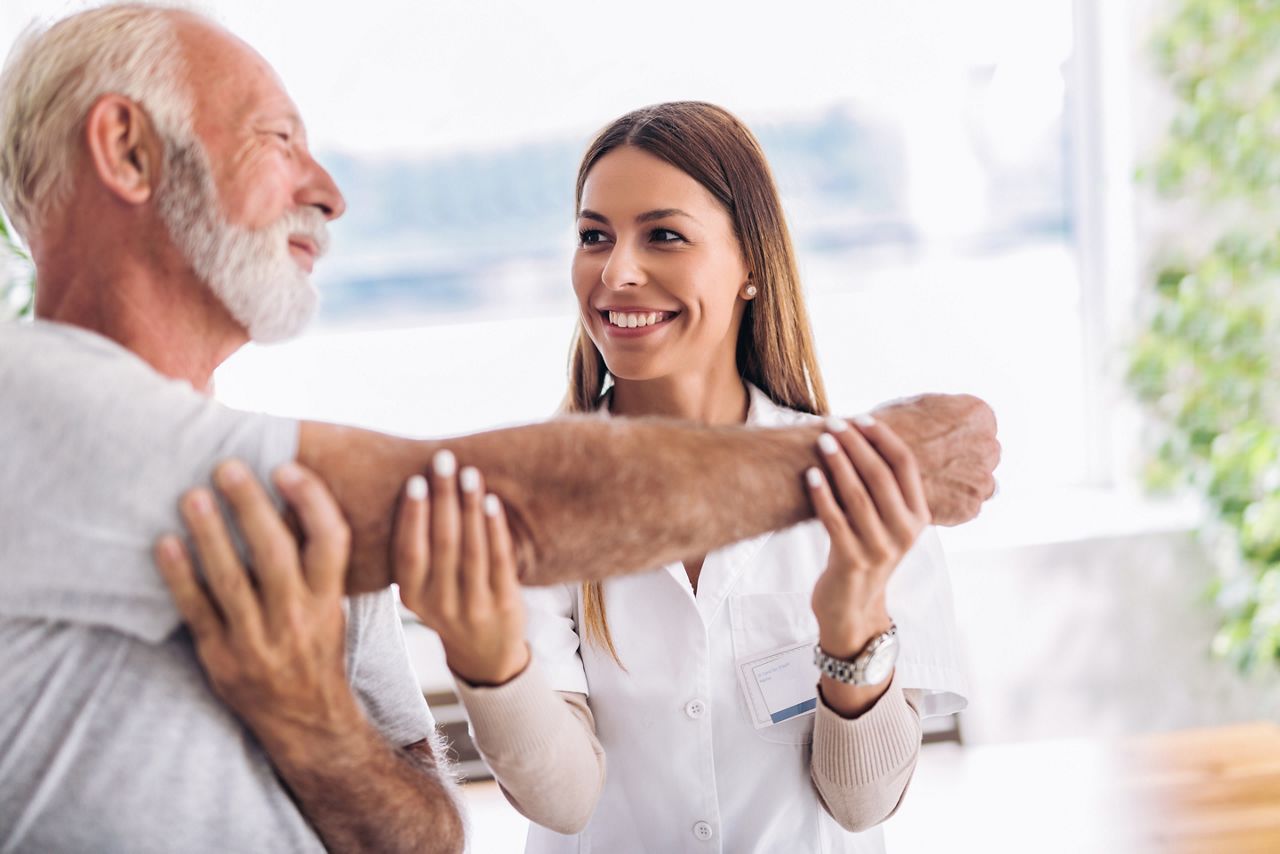 Man having chiropractic arm adjustment. Physiotherapy, sport injury rehabilitation. Senior man exercises in center for chiropractic.; Shutterstock ID 1163824108; purchase_order: 25 thumbnail photos ; job: ; client: ; other: 
