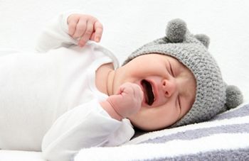 little baby crying on bed; Shutterstock ID 130593884; purchase_order: DNC Thumbnails; job: Publications; client: ; other: 