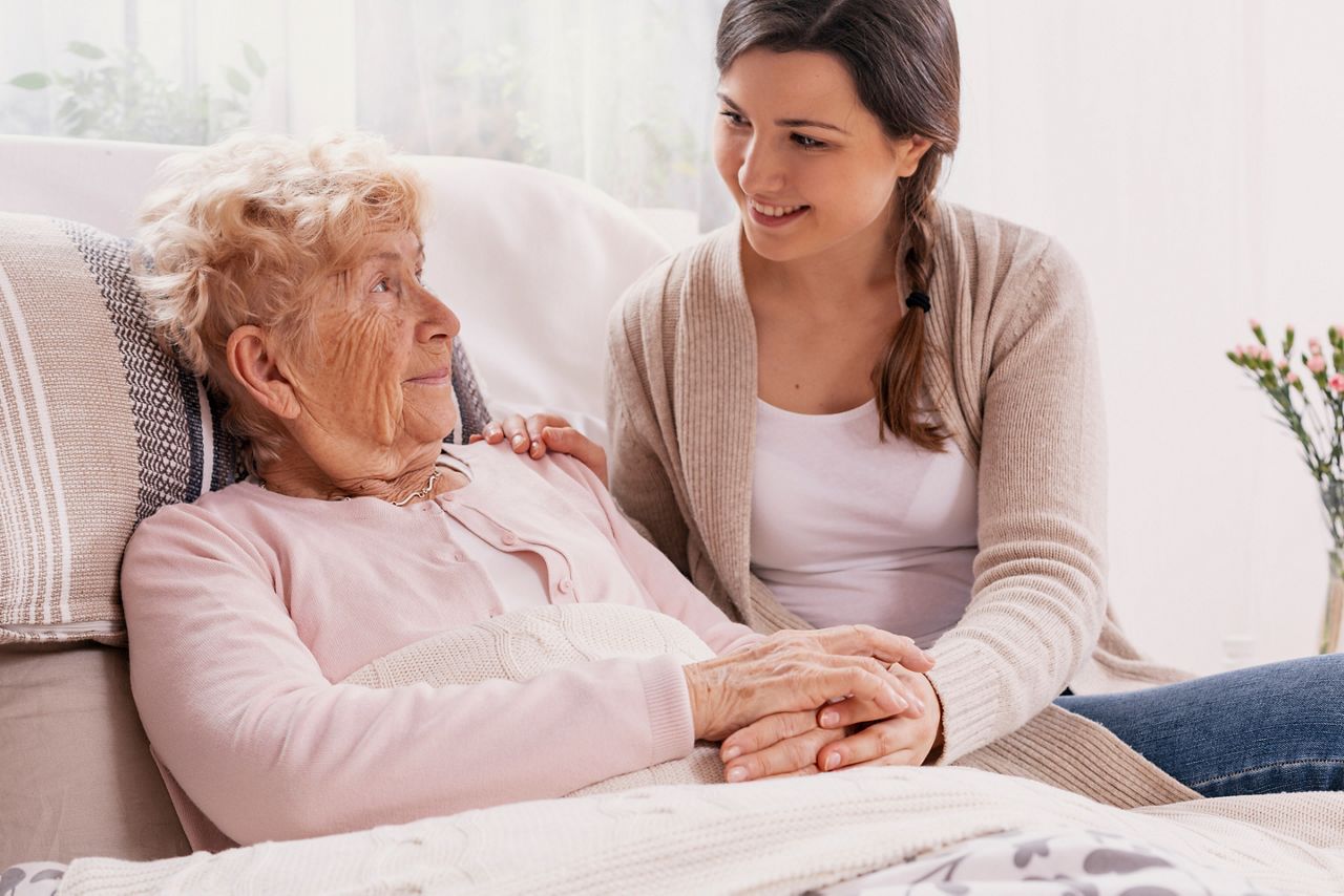 Young daughter supporting sick mother lying in hospital bed; Shutterstock ID 1342049798; purchase_order: DNC Thumbnails; job: Infographics; client: ; other: 