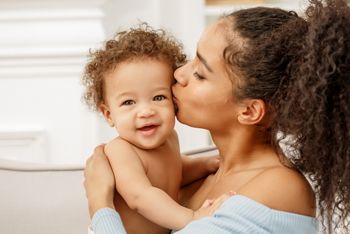 Love of a mother and baby. Family in the house. Lifestyle; Shutterstock ID 1411008233; purchase_order: DNC Thumbnails; job: Webinars; client: ; other: Replacements
