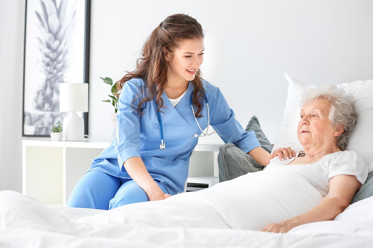 Medical worker with senior woman in nursing home; Shutterstock ID 1441878722; purchase_order: DNC thumbnail; job: Stroke infographic; client: ; other: 