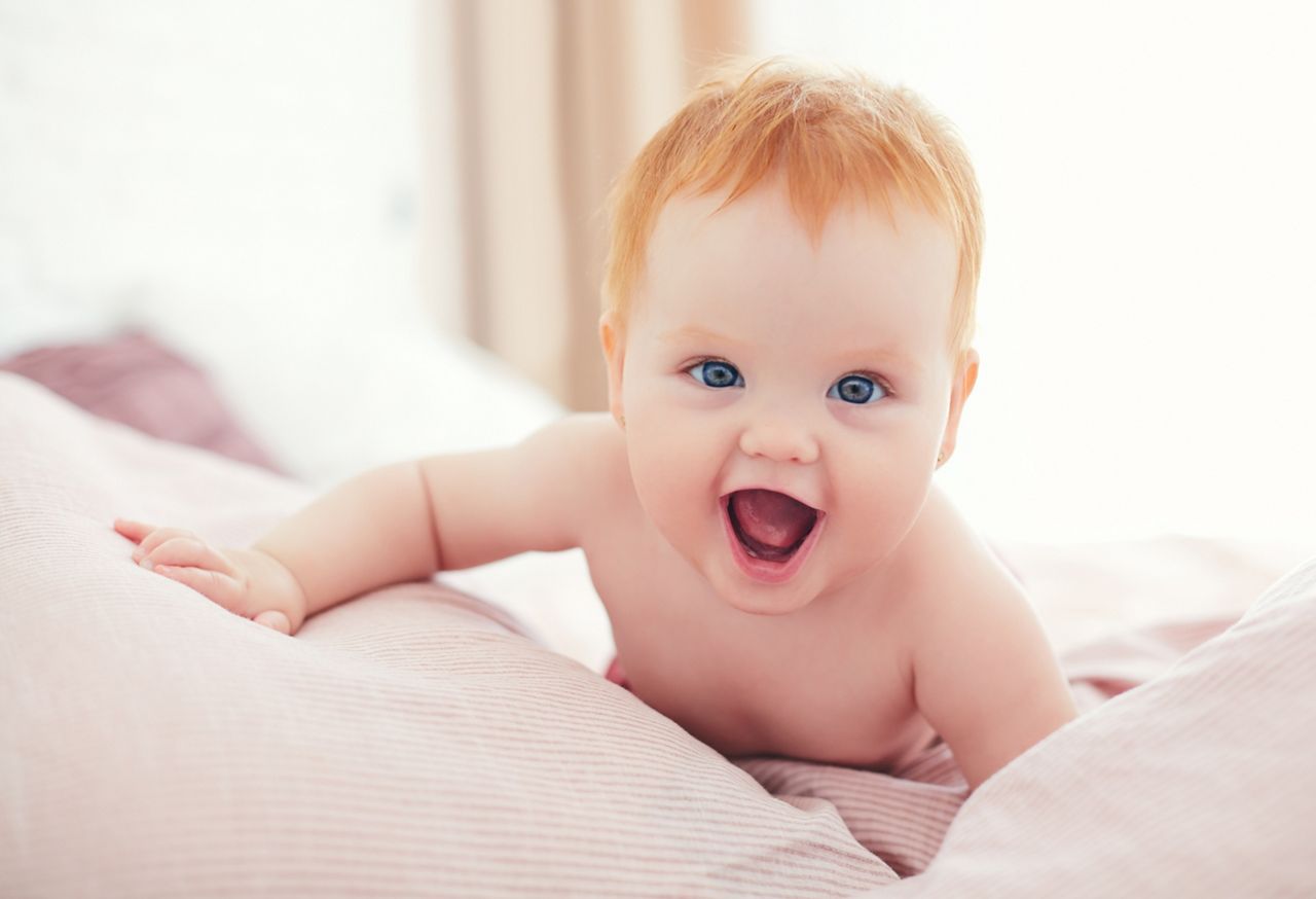 happy excited infant baby girl crawling on the bed; Shutterstock ID 1458206714; purchase_order: DNC Thumbnails; job: Webinars 2 (50/188); client: ; other: 