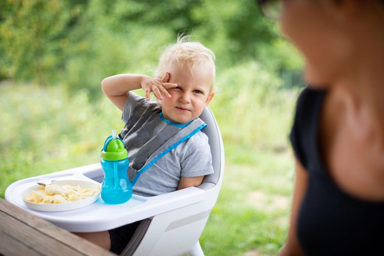 Offended and fussy little child boy during eating outdoor; Shutterstock ID 1572283030; purchase_order: PR2138319; job: OMG1131771 ; client: Healthcare NPS; other: 336