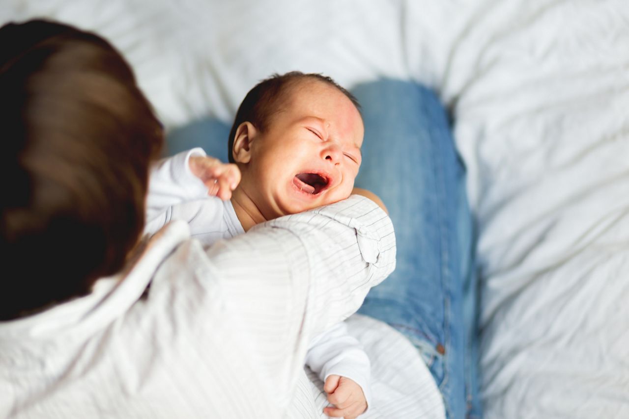 Woman holding a crying child. Mother comforts her little son or daughter.; Shutterstock ID 1616587417; purchase_order: DNC Thumbnails; job: Webinars 1 (50/189); client: ; other: 