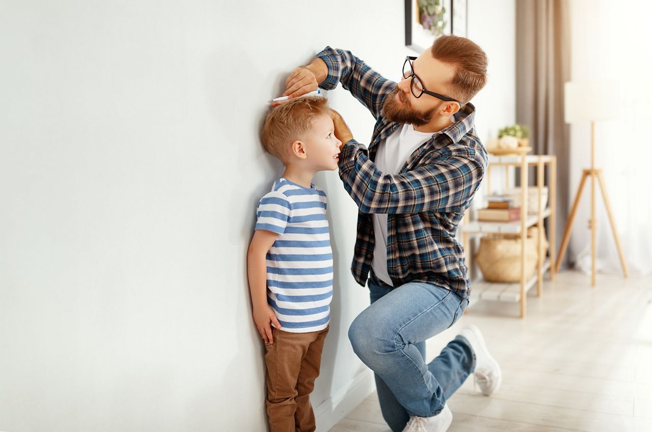 concept of development, growing up. a father measures height of his young child son
; Shutterstock ID 1660582093; purchase_order: DNC Thumbnails; job: Webinars 4 ; client: ; other: 