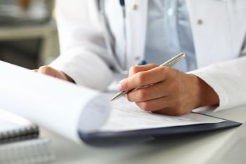 Hands of female GP making notes with silver pen while receiving visitor close-up; Shutterstock ID 1706358571; purchase_order: DNC Thumbnails; job: Webinars 3 (50/188); client: ; other: 