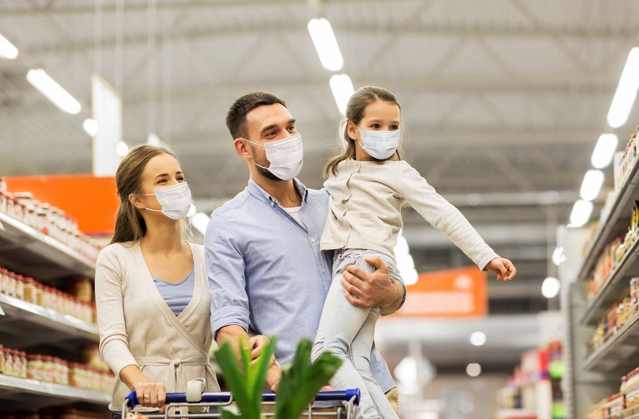 sale, family and pandemic concept - happy mother, father and little daughter wearing face protective medical masks for protection from virus disease with shopping cart buying food at supermarket; Shutterstock ID 1723575214; purchase_order: DNC Thumbnails; job: Webinars; client: ; other: Replacements