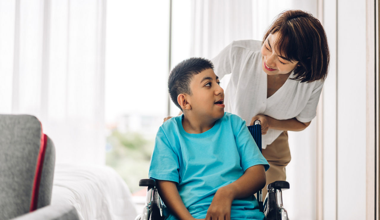 Portrait of enjoy happy love family asian mother playing and carer helping look at disabled son child sitting in wheelchair moments good time at home.disability care concept; Shutterstock ID 1757866598; purchase_order: PR2138319; job: OMG1131771 ; client: Healthcare NPS; other: 336