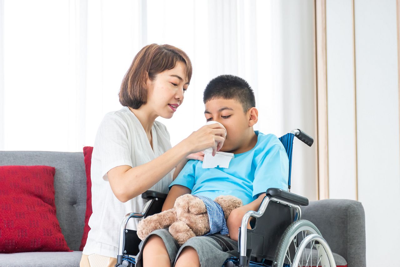asian mother feeding drinking water to disabled child on wheelchair; Shutterstock ID 1774560467; purchase_order: DNC Thumbnails; job: Webinars 1 (50/189); client: ; other: 