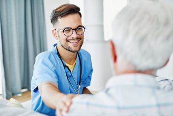 Doctor or male caregiver with senior man holding a cane on sofa at home or nursing home; Shutterstock ID 1783795256; purchase_order: DNC Thumbnails; job: Webinars 3 (50/188); client: ; other: 