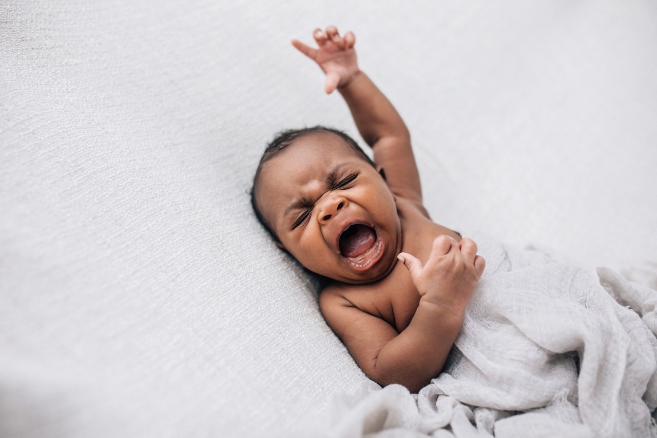 Crying and upset beautiful African American baby boy on a cream background; Shutterstock ID 1790857484; purchase_order: DNC Thumbnails; job: Webinars 2 (50/188); client: ; other: 