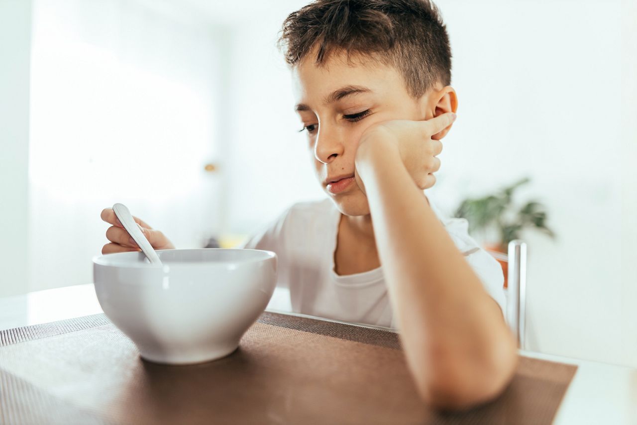 Child with poor appetite during the meal. Concept of lack of appetite.; Shutterstock ID 1834993216; purchase_order: DNC Thumbnails; job: Webinars 2 (50/188); client: ; other: 