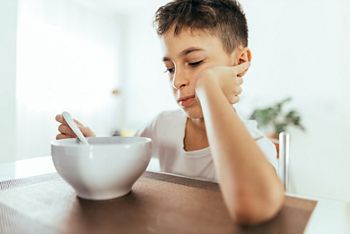 Child with poor appetite during the meal. Concept of lack of appetite.; Shutterstock ID 1834993216; purchase_order: DNC Thumbnails; job: Webinars 2 (50/188); client: ; other: 