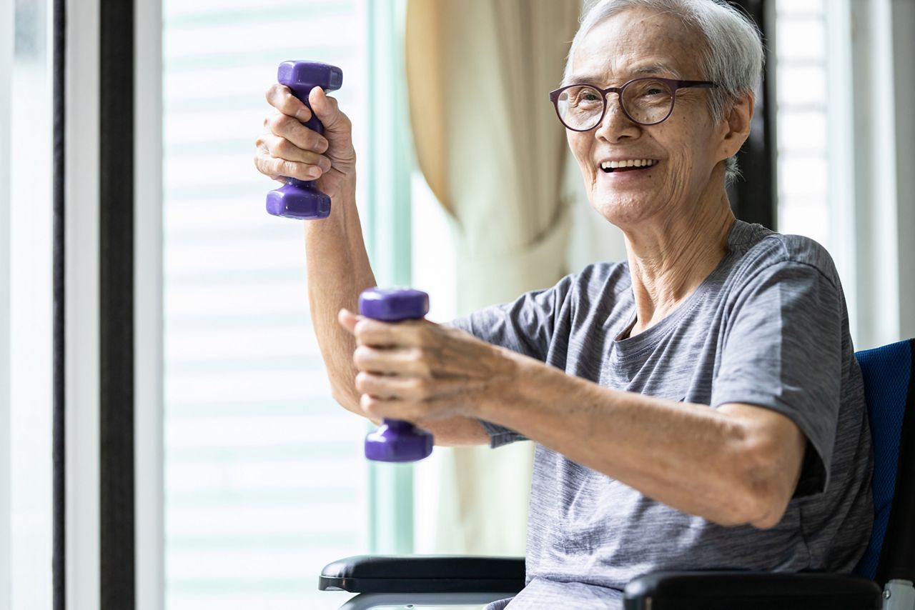 Strong asian senior woman working out with heavy dumbbells,lifting dumbbell weights for strength training,fitness elderly people doing exercise while sit in wheelchair,health care,healthy lifestyle; Shutterstock ID 1857707776; purchase_order: DNC Thumbnails; job: Webinars 3 (50/188); client: ; other: 