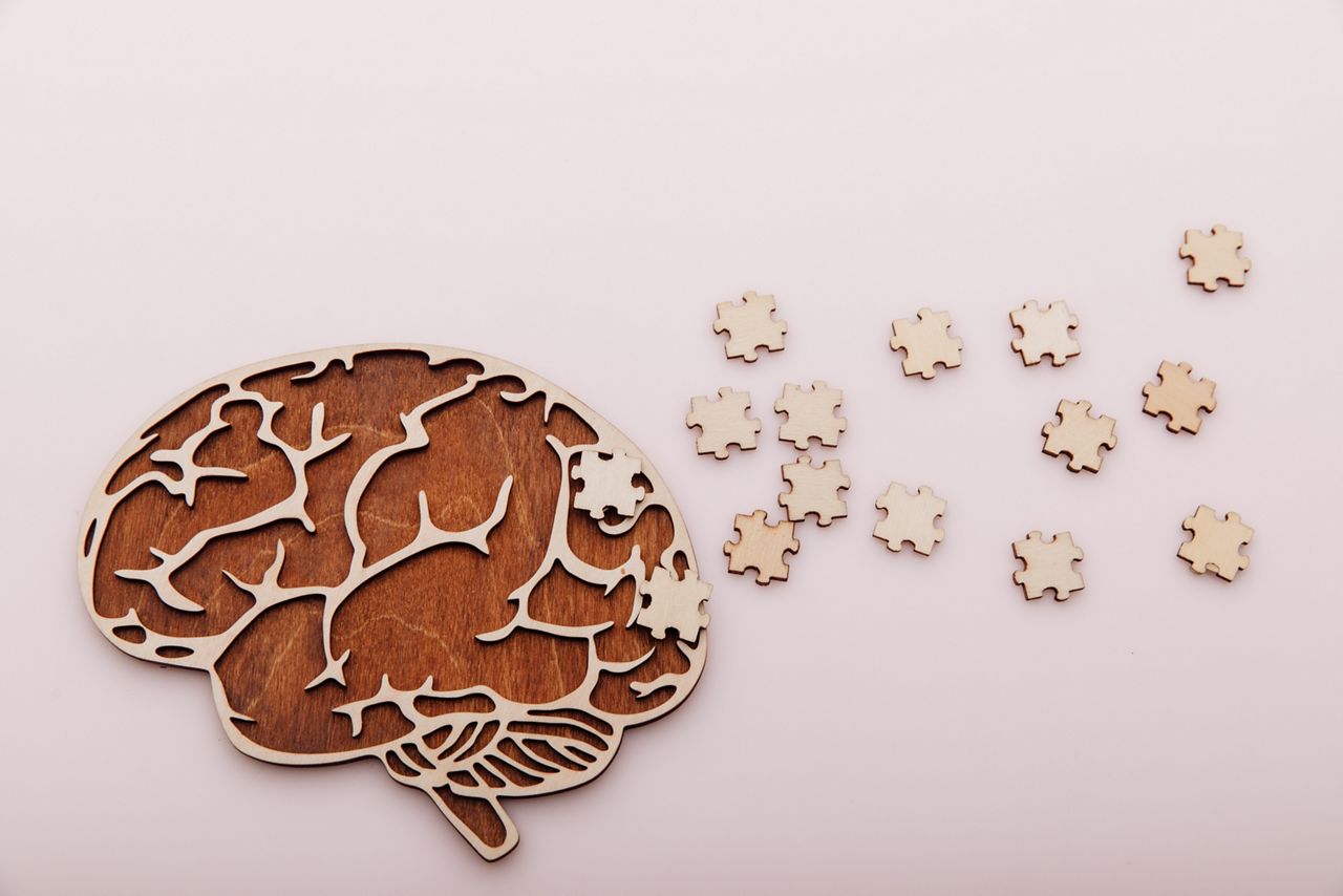 Alzheimer's disease and mental health concept. Brain and wooden puzzle on a pink background; Shutterstock ID 1956135961; purchase_order: DNC Thumbnails; job: Videos; client: ; other: 