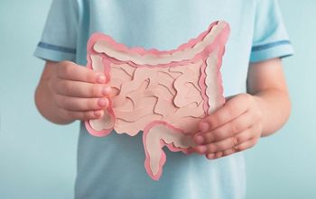 Child holding decorative model intestine. Healthy digestion children concept, probiotics and prebiotics for microbiome intestine. Close up; Shutterstock ID 2029232828; purchase_order: DNC Thumbnails; job: Webinars 3 (50/188); client: ; other: 