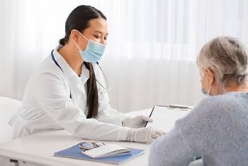 Senior woman visiting doctor in clinic; Shutterstock ID 2061288221; purchase_order: DNC Thumbnails; job: Webinars; client: ; other: Replacements