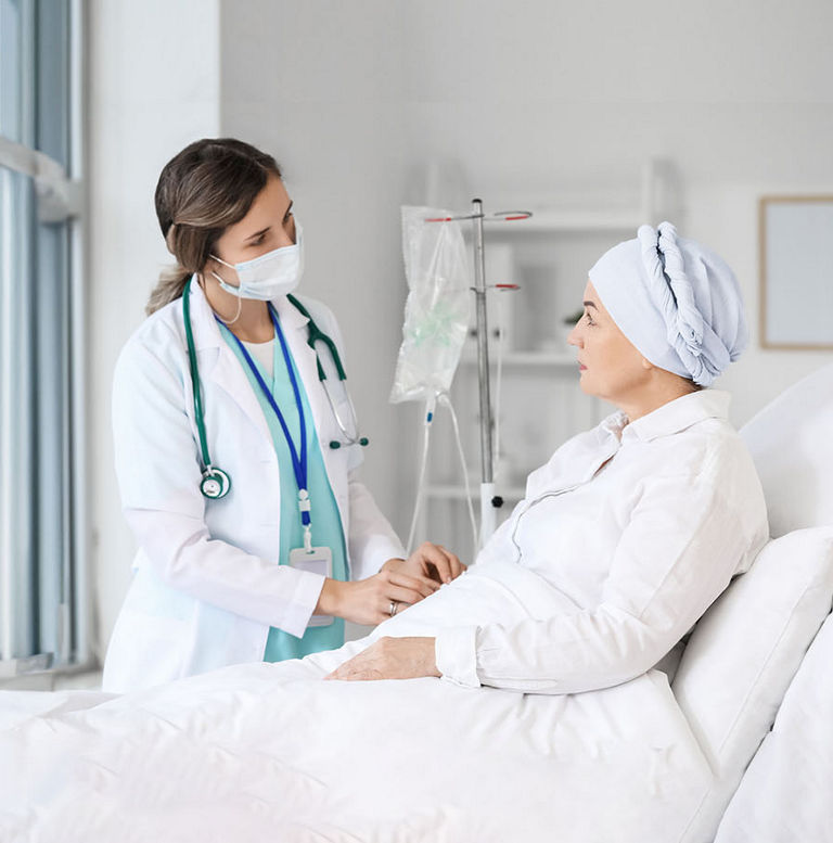 Doctor and mature woman undergoing chemical therapy course in clinic; Shutterstock ID 2088804919; purchase_order: DNC thumbnails; job: Adult booklets ; client: ; other: 