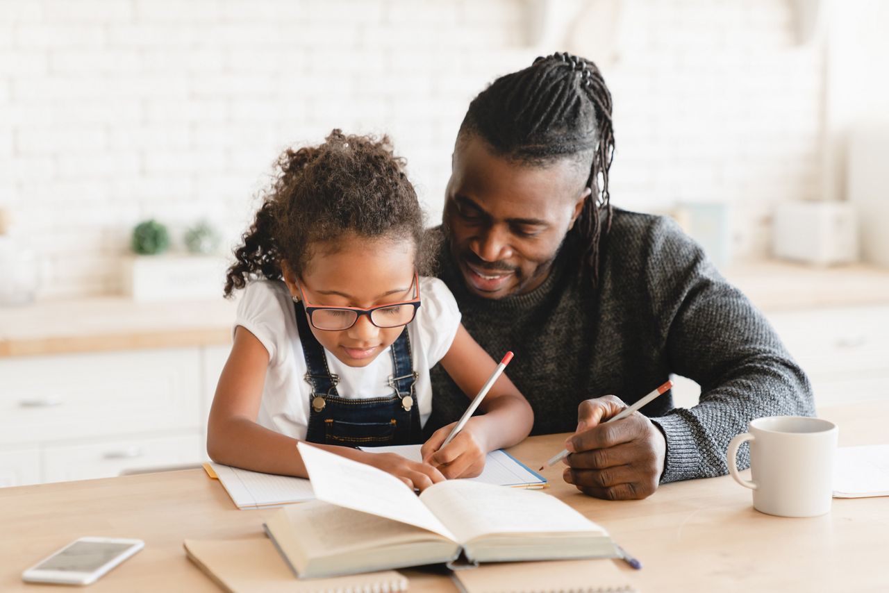 African-american father dad tutor childminder helping assisting with homework school project to a preteen daughter student. Homeschool concept. E-learning; Shutterstock ID 2120194262; purchase_order: DNC Thumbnails; job: Webinars 1 (50/189); client: ; other: 