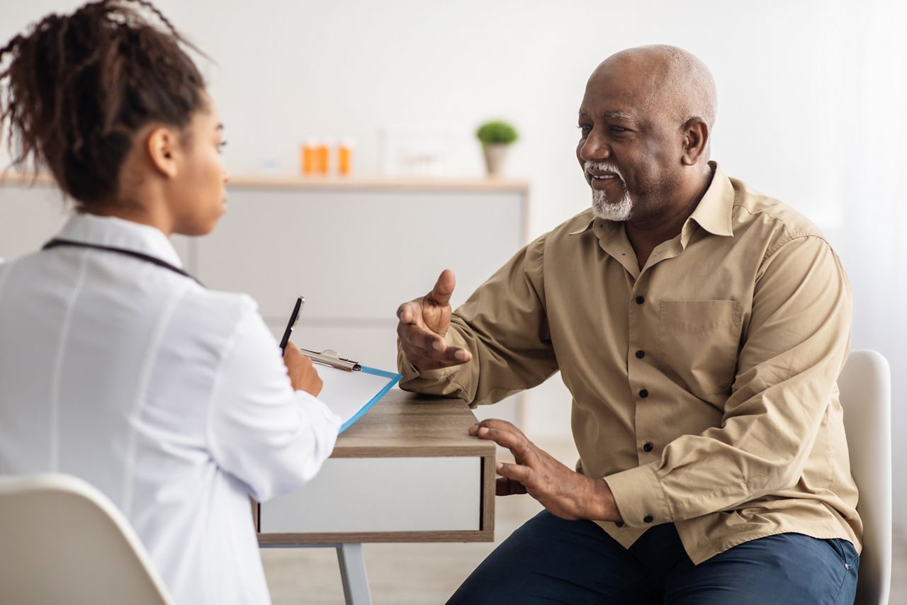 Healthcare, Geriatric Medicine, Medical Check Up. Senior man visiting doctor telling about health complaints, female gp or nurse writing personal information, filling form listening to elderly patient; Shutterstock ID 2159141583; purchase_order: SN event thumbnails; job: ; client: ; other: 