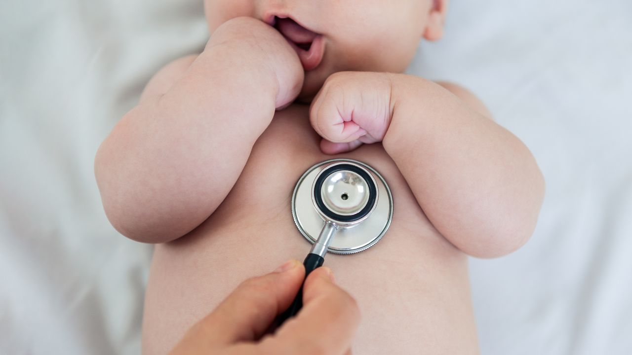 Female doctor examining baby boy toddler listening to lungs with stethoscope. A nurse having medical checkup with sick little newborn patient in clinic. Pediatrician's appointment, healthcare concept; Shutterstock ID 2183808673; purchase_order: SN event thumbnails; job: ; client: ; other: 