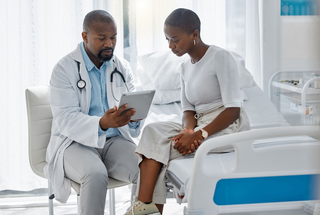 Doctor consulting patient with digital tablet, discussing diagnosis and medical checkup in hospital. Healthcare worker and trusted physician in appointment with medicine advice, wellness and; Shutterstock ID 2191879849; purchase_order: DNC Thumbnails; job: Webinars 3 (50/188); client: ; other: 
