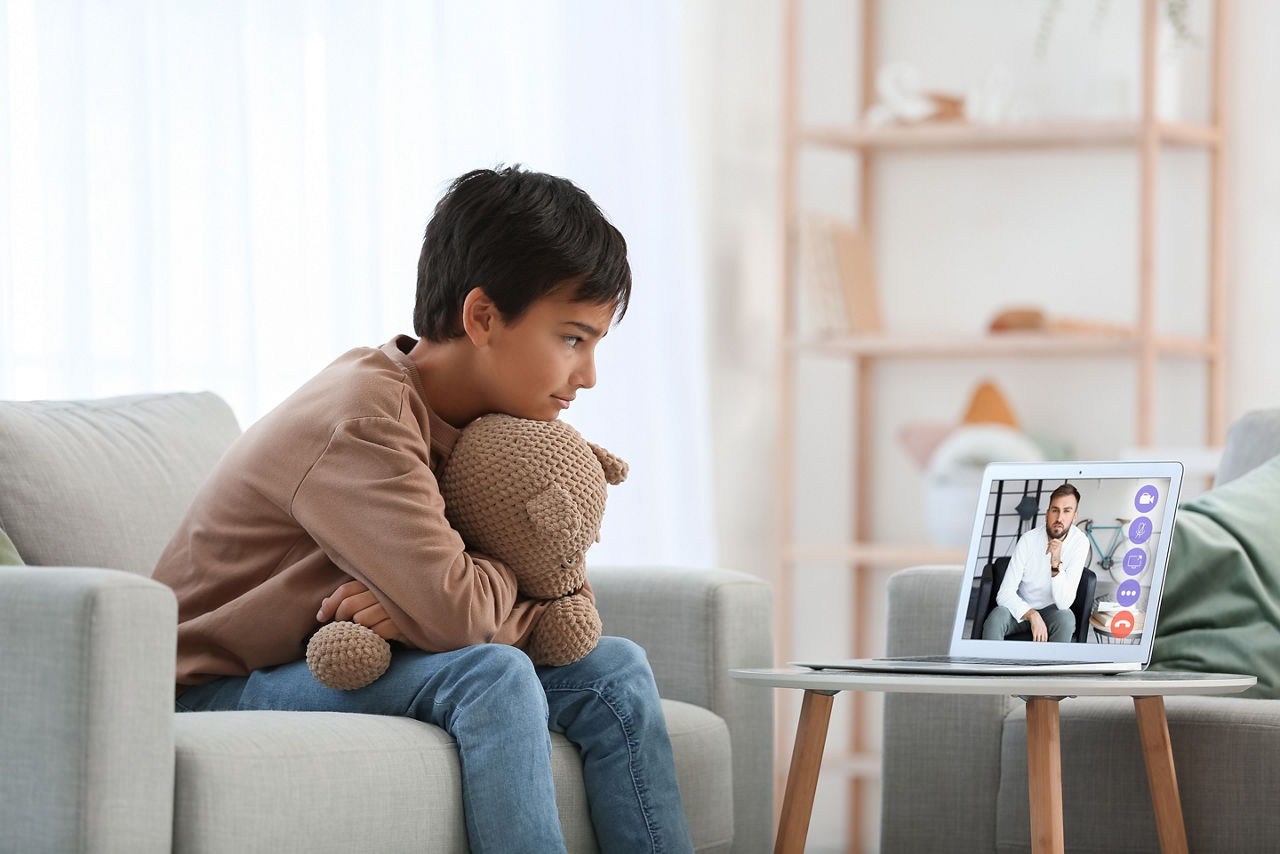Little boy video chatting with psychologist at home; Shutterstock ID 2262438297; purchase_order: PR2138319; job: OMG1131771 ; client: Healthcare NPS; other: 336