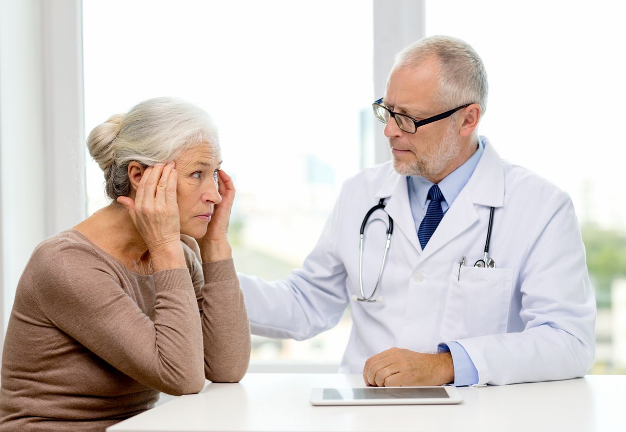 medicine, age, health care and people concept - senior woman and doctor with tablet pc computer meeting in medical office; Shutterstock ID 256418608; purchase_order: DNC Thu  ; job: ; client: ; other: 