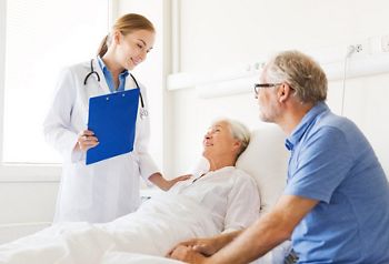medicine, age, health care and people concept - senior woman, man and doctor with clipboard at hospital ward; Shutterstock ID 296282774; purchase_order: DNC Thumbnails; job: Webinars 2 (50/188); client: ; other: 