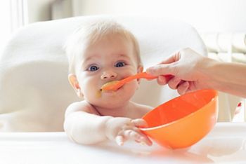 Beautiful baby eating mashed; Shutterstock ID 308793989; purchase_order: DNC Thumbnails; job: Webinars 4 ; client: ; other: 