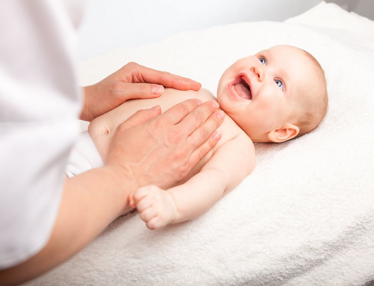 Three month baby girl is receiving chest massage from a female massage therapist; Shutterstock ID 331629164; purchase_order: DNC Thumbnails; job: Webinars 3 (50/188); client: ; other: 