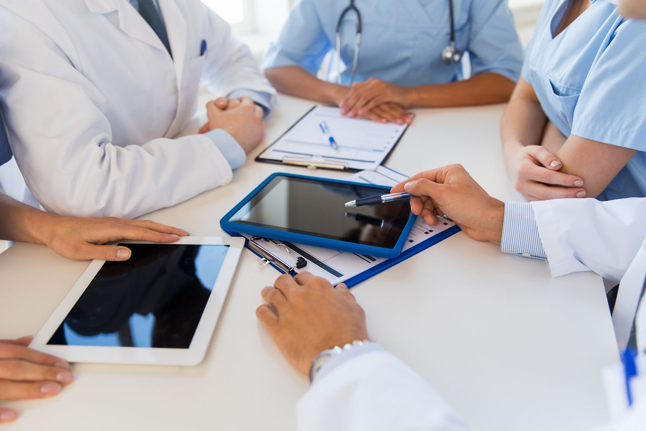 technology, people and medicine concept - group of doctors with tablet pc computers and clipboards meeting at hospital; Shutterstock ID 337142402; purchase_order: DNC Thumbnails; job: Webinars 2 (50/188); client: ; other: 