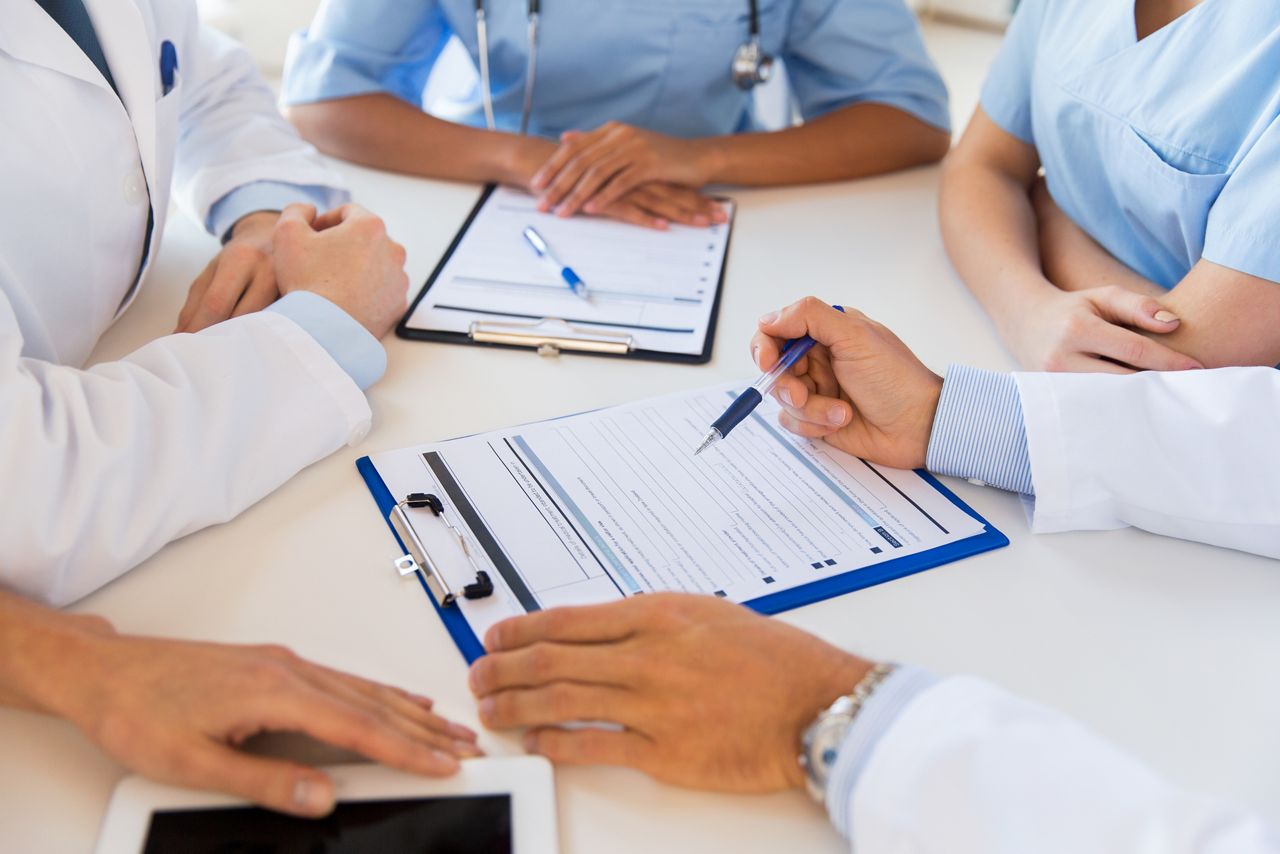 technology, people and medicine concept - close up of doctors with clipboards doctors at conference in hospital; Shutterstock ID 343008413; purchase_order: DNC thumbnails; job: GLIM; client: ; other: 