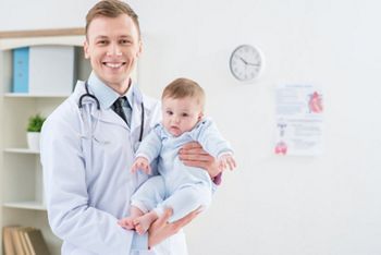 Professional pediatrician holding infant ; Shutterstock ID 372633088; purchase_order: DNC Thumbnails; job: Courses; client: ; other: Replace Fishwife