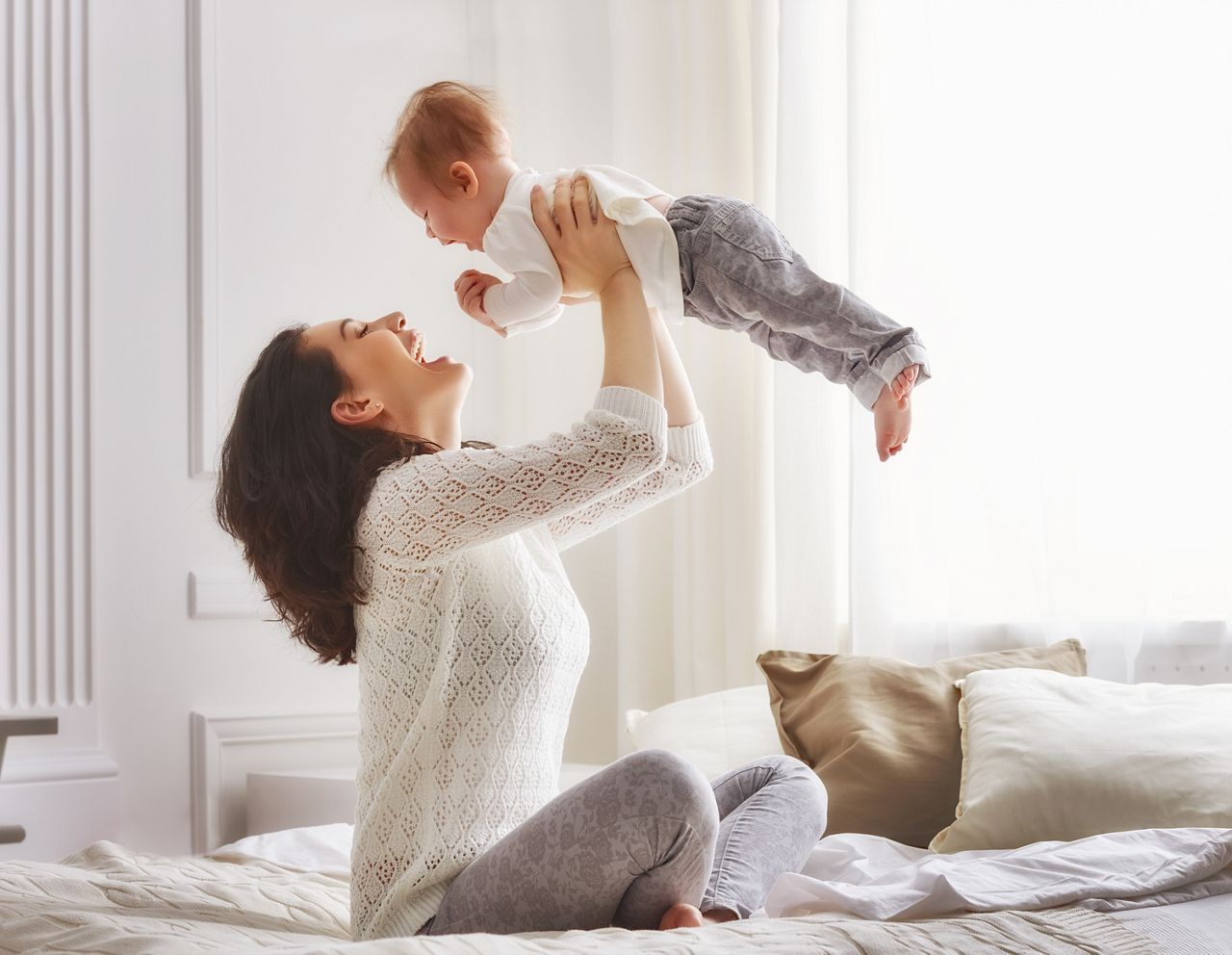 happy loving family. mother playing with her baby in the bedroom.; Shutterstock ID 398163976; purchase_order: DNC Thumbnails; job: Webinars 4 ; client: ; other: 