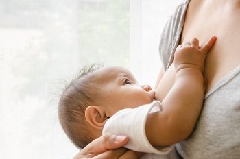 Mother breastfeeding her newborn baby beside window. Milk from mom’s breast is a natural medicine for children.; Shutterstock ID 461418109; purchase_order: DNC Thumbnails; job: Podcasts (3/6); client: ; other: 