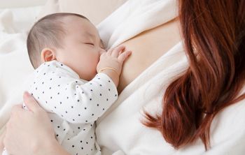 Six months old asian baby drinking breastmilk; Shutterstock ID 522973660; purchase_order: DNC Thumbnails; job: Webinars 1 (50/189); client: ; other: 