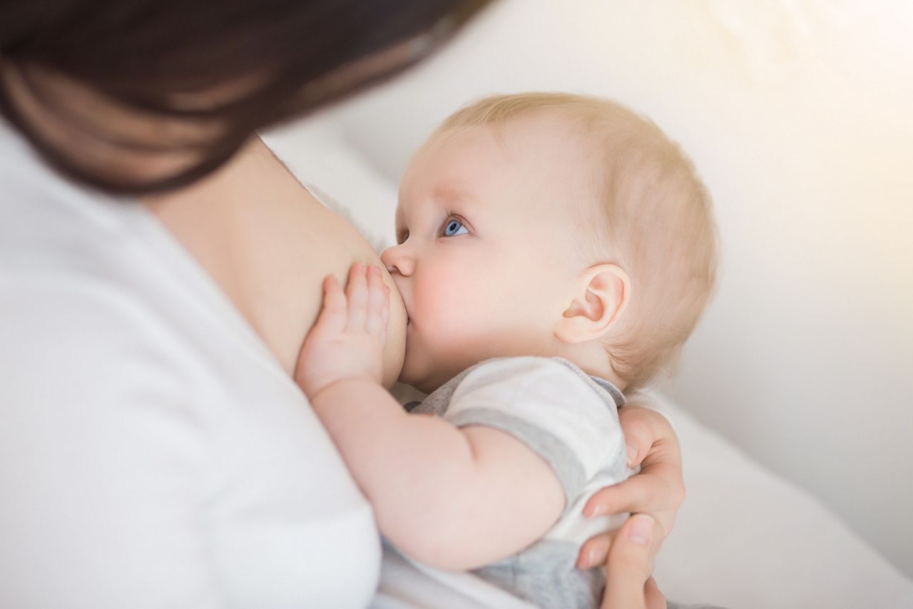 mother breastfeeding and hugging baby. Young mom breast feeding her newborn child. Lactation infant concept. Baby eating milk before he sleeping. Mother feed her six month baby son with breast milk; Shutterstock ID 528384532; purchase_order: DNC Thumbnails; job: Webinars 3 (50/188); client: ; other: 