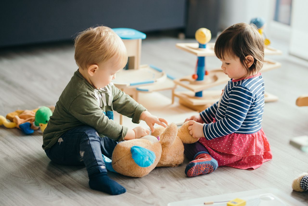 cute little girl and boy playing with toys by the home; Shutterstock ID 570751849; purchase_order: DNC Thumbnails; job: Webinars 1 (50/189); client: ; other: 