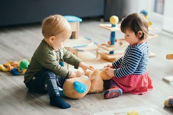 cute little girl and boy playing with toys by the home; Shutterstock ID 570751849; purchase_order: DNC Thumbnails; job: Webinars 1 (50/189); client: ; other: 