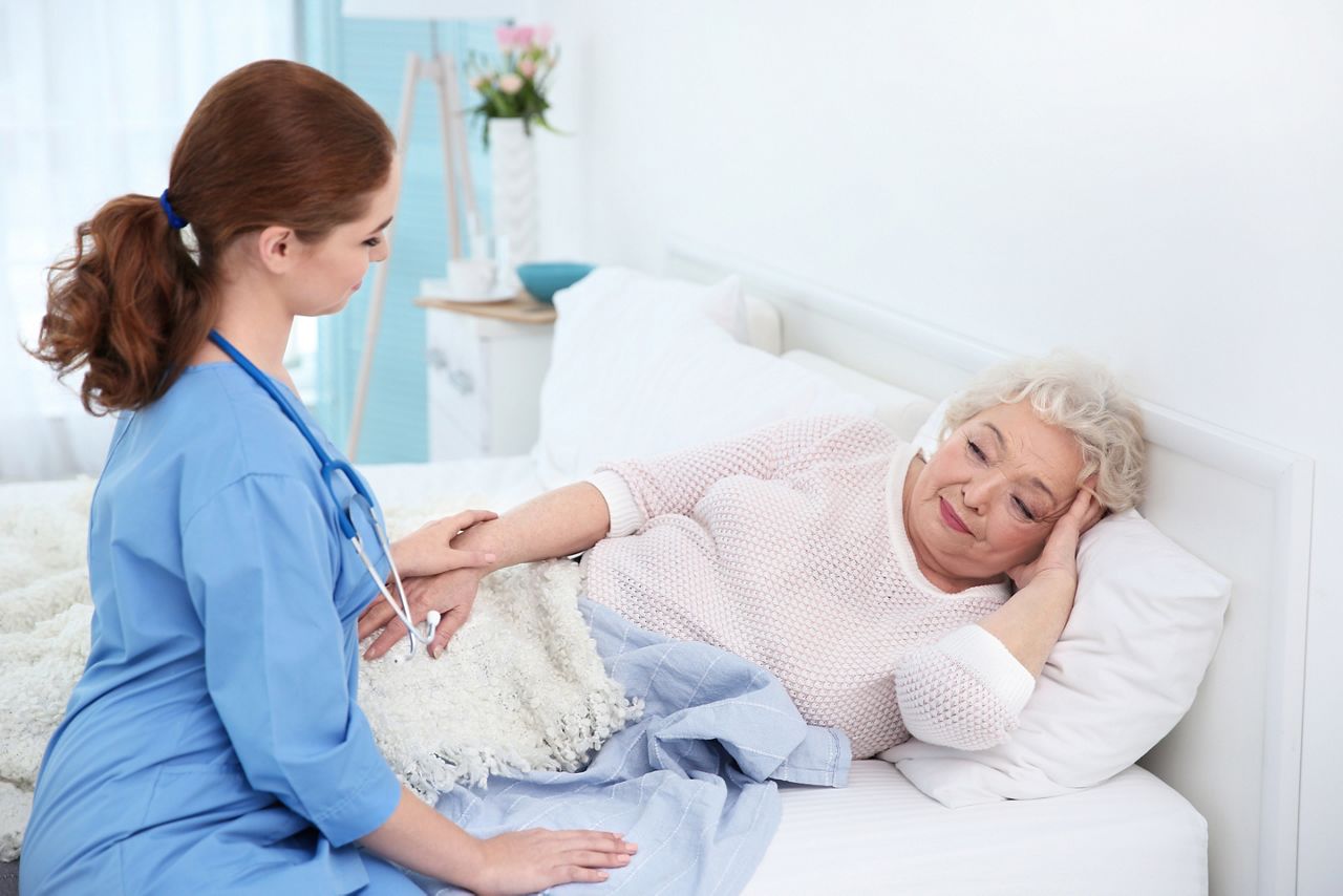 Nurse talking with elderly woman in light room; Shutterstock ID 582465586; purchase_order: DNC Thumbnails; job: Publications; client: ; other: Replace Fishwife