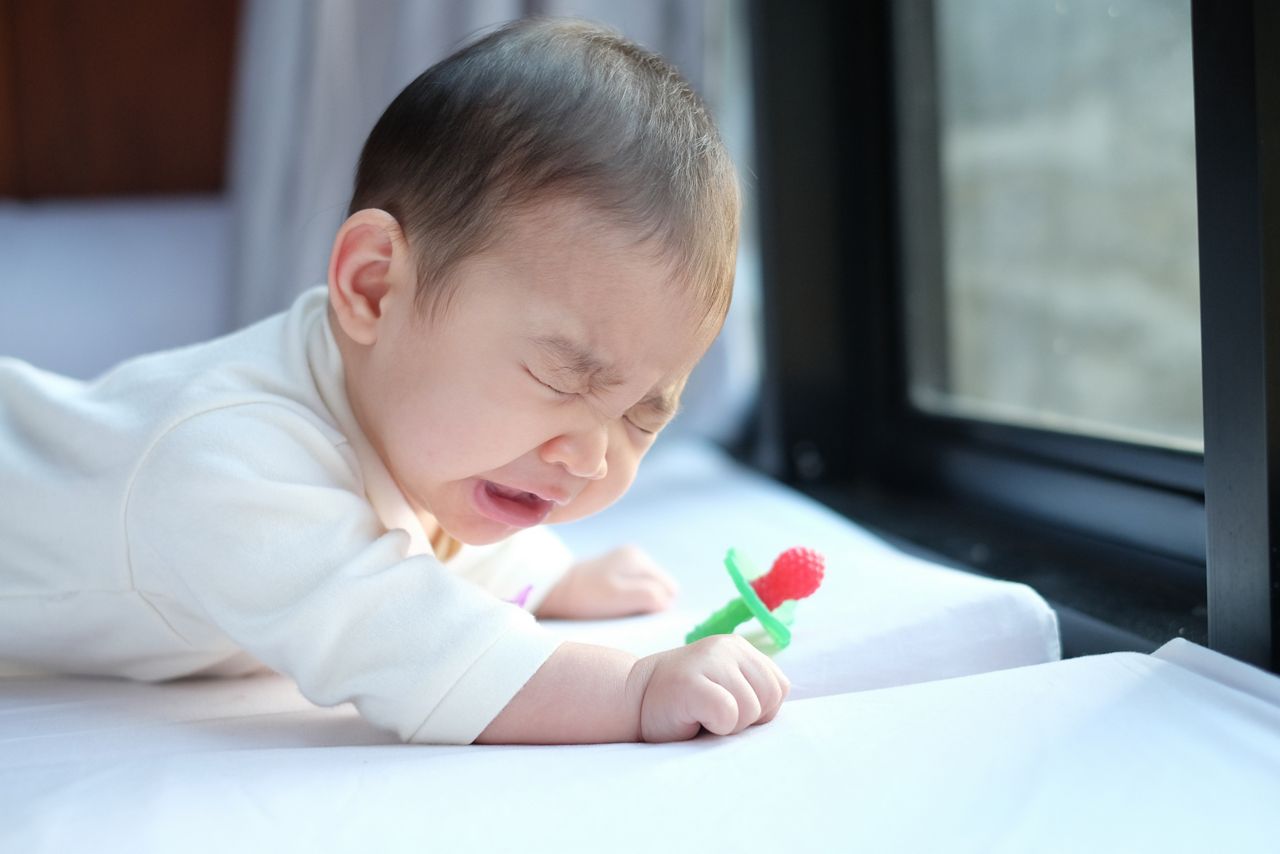 Portrait of cute baby lying in bed and  sneeze; Shutterstock ID 594026162; purchase_order: DNC Thumbnails; job: Webinars 2 (50/188); client: ; other: 