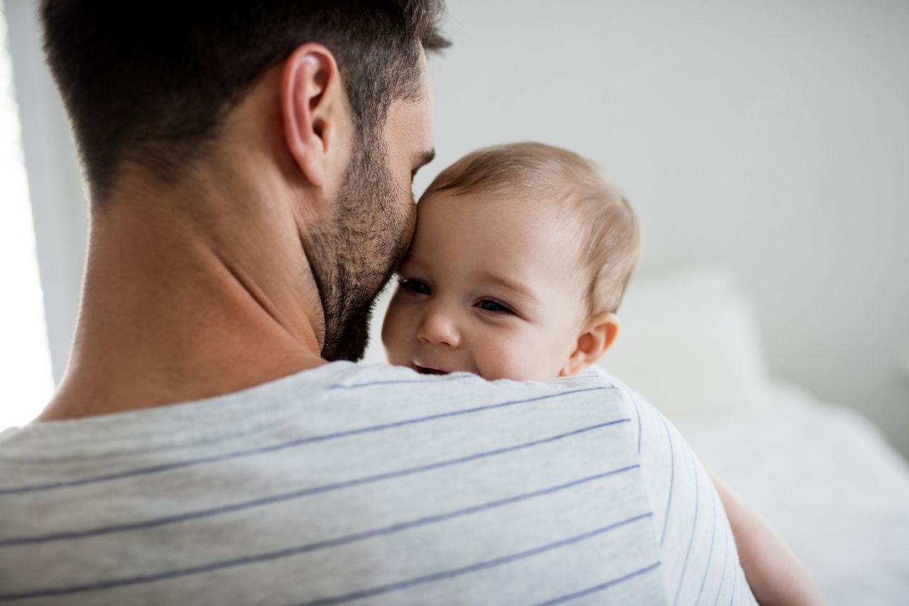 Father holding his baby girl at home; Shutterstock ID 631172234; purchase_order: DNC Thumbnails; job: Booklets; client: ; other: 