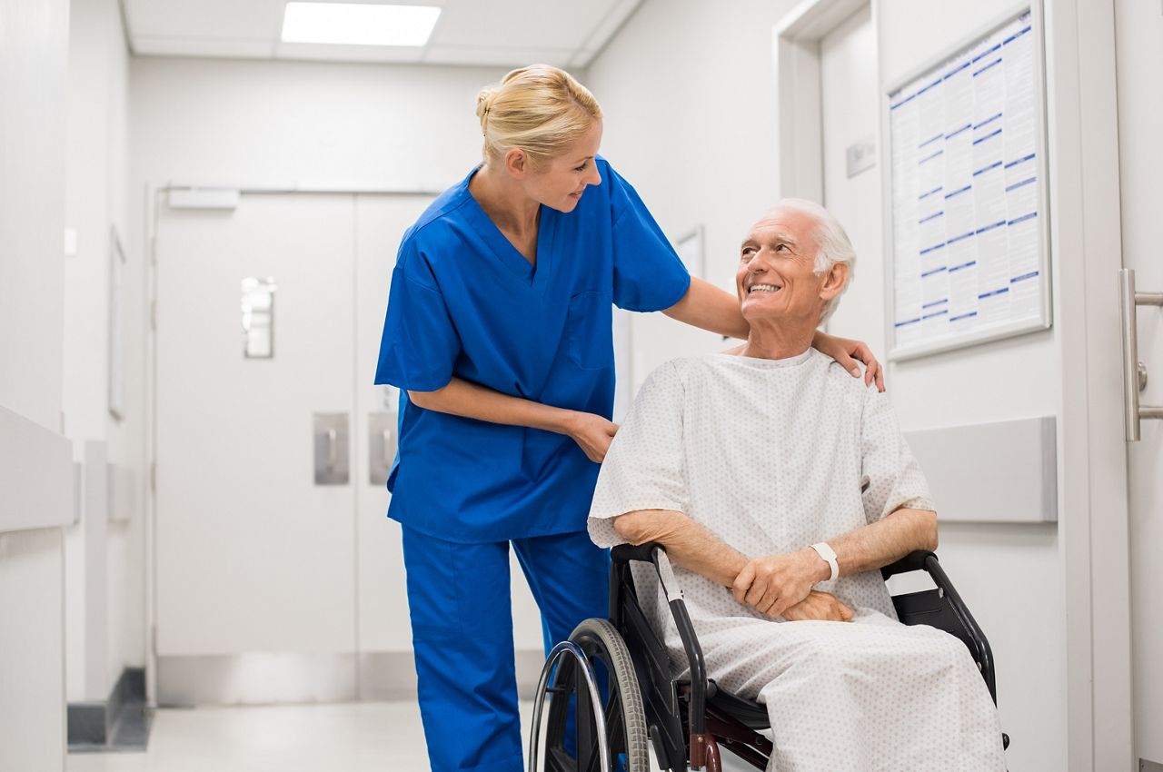 Nurse looking at elderly patient in a wheelchair in hospital ward. Doctor talking to old disabled in hospital hallway.; Shutterstock ID 643149502; purchase_order: DNC Thumbnails; job: Webinars 2 (50/188); client: ; other: 