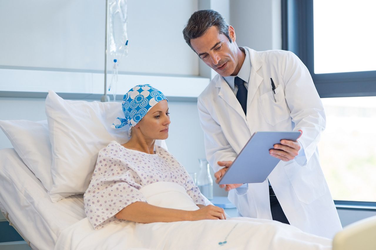 Doctor telling to patient woman the results of her medical tests. Doctor showing medical records to cancer patient in hospital ward. Senior doctor explaint the side effects of the intervention.; Shutterstock ID 645685942; purchase_order: DNC Thumbnails; job: Webinars 1 (50/189); client: ; other: 