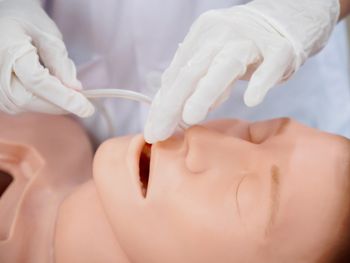 Close-up detail of a physician inserting a nasogastric tube into a training model. Healthcare and education concept.; Shutterstock ID 659625325; purchase_order: DNC Thumbnails; job: Videos; client: ; other: 