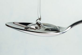 Pouring Light Corn Syrup on a Spoon; Shutterstock ID 671435683; purchase_order: DNC Thumbnails; job: Publications; client: ; other: 