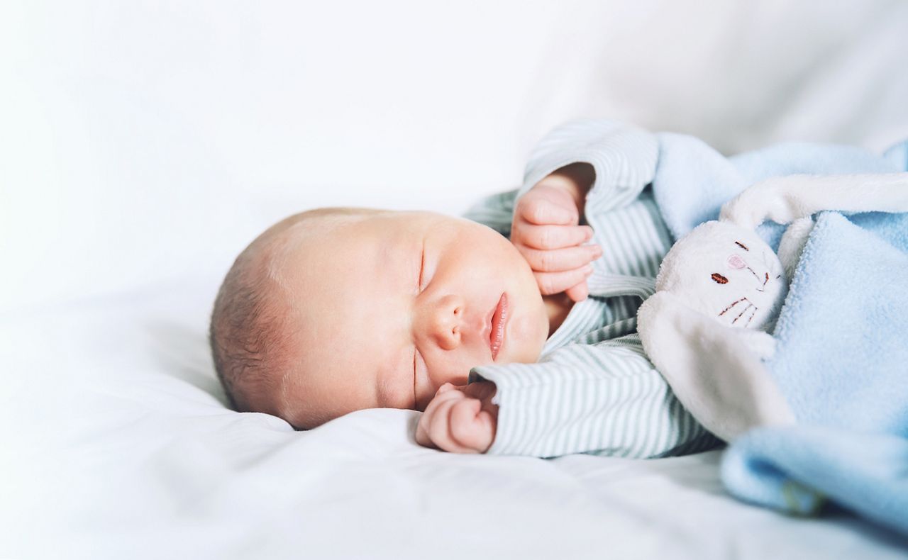 Newborn baby sleep first days of life. Cute little newborn child sleeping peacefully; Shutterstock ID 714484453; purchase_order: DNC Thumbnails; job: Publications; client: ; other: 