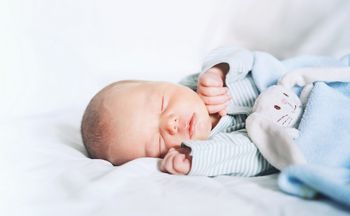 Newborn baby sleep first days of life. Cute little newborn child sleeping peacefully; Shutterstock ID 714484453; purchase_order: DNC Thumbnails; job: Publications; client: ; other: 